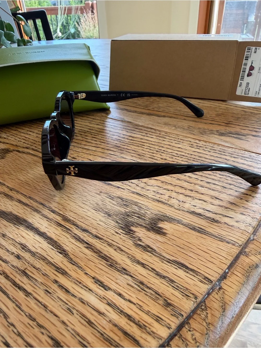 Tory Burch Black Frame Sunglasses with Violet Polarized Lenses